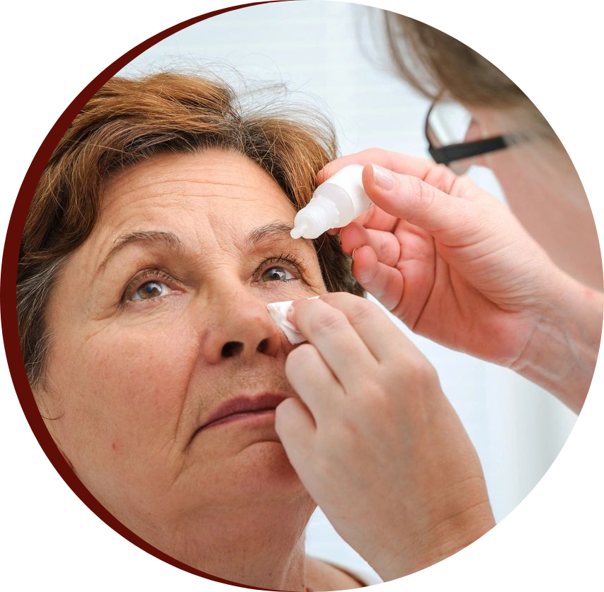 A woman putting eye drop on old lady eye